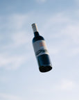Bottle of Blind Corner Organic Cabernet against the sky