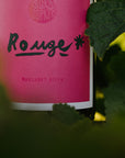 Blind Corner Organic and Biodynamic Margaret River Rouge label close-up. Vine leaves frame the pink label