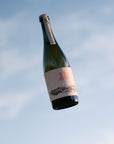 Blind Corner Organic and Biodynamic Margaret River Cremant against the sky