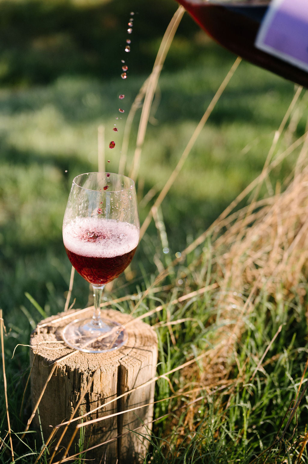 Blind Corner Organic and Biodynamic Margaret River Nouveau being poured into a glass in an outdoor setting 